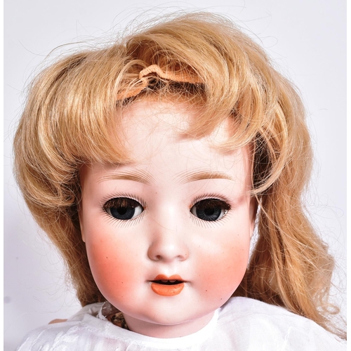 99 - An early 20th Century German Schoenau & Hoffmeister Porzellanfabrik Burggrub bisque headed doll. The... 