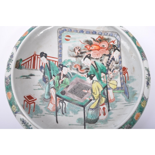 102 - An early 20th century Chinese porcelain hand painted low bowl / dish. Decorated with a group of figu... 