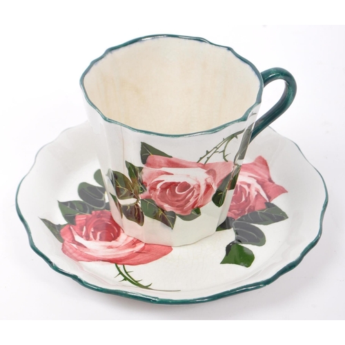 104 - Early 20th century George Stewart Bristol pottery. Rose pattern comprising of a cup, saucer, side pl... 