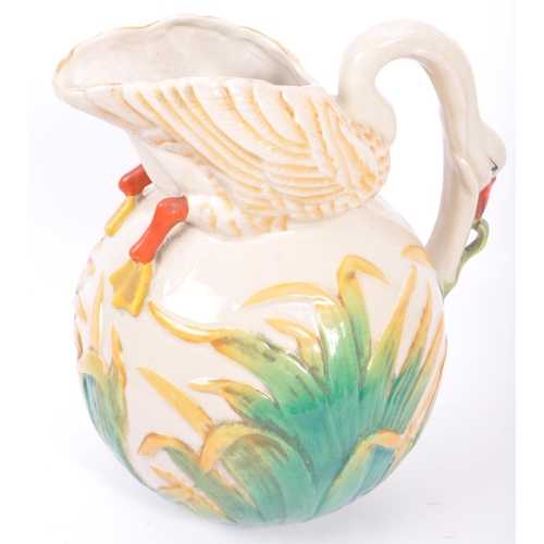 129 - A Victorian 19th century ceramic pottery majolica swan vase / jug. In the manner of George Jones. Ha... 