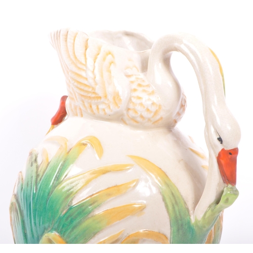 129 - A Victorian 19th century ceramic pottery majolica swan vase / jug. In the manner of George Jones. Ha... 