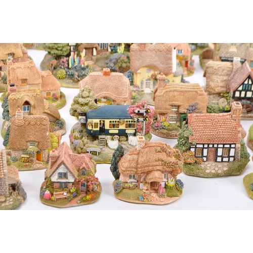 130 - A large collection of vintage 20th century unboxed 'Lilliput Lane' cottage figures to include; St La... 