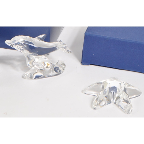 142 - Swarovski - A collection of vintage 20th century Swarovski Crystal glass boxed sea animal related fi... 