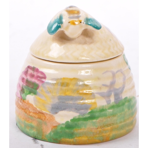 144 - Clarice Cliff - 1930's / Mid 20th Century Art Deco Bizarre design honey pot. Having a domed cover wi... 