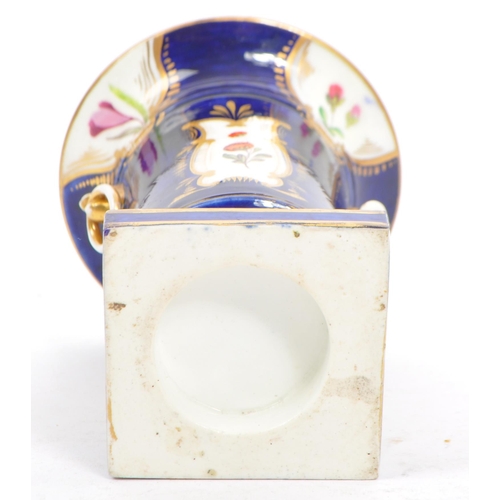 154 - Manner of Coalport porcelain. A Regency 19th century cobalt blue and floral spray decorated spill va... 