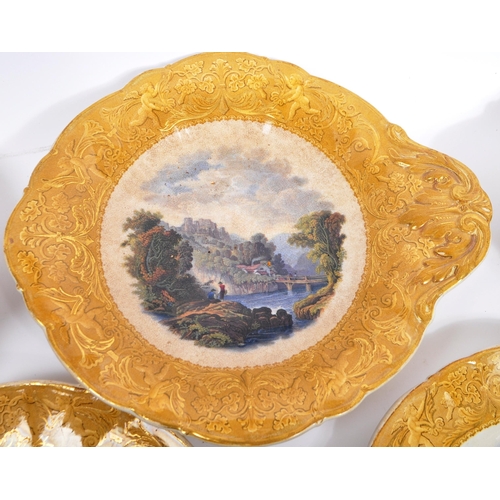 162 - A collection of 19th century Victorian ceramic dinner plates and tazzas. Depicting a mountainous riv... 