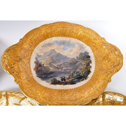 162 - A collection of 19th century Victorian ceramic dinner plates and tazzas. Depicting a mountainous riv... 