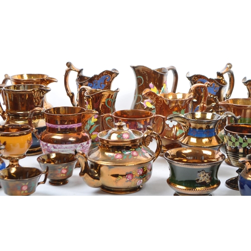 171 - A large collection of 19th century Victorian lustre ware jugs, with copper / brown design to ground.... 