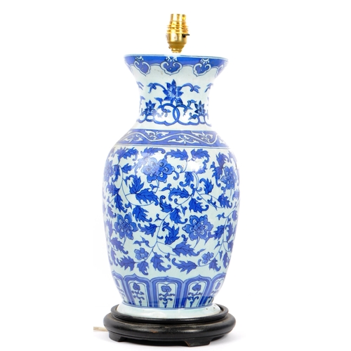 172 - A collection of 19th century ceramic pottery lamp and vases. Blue and white lamp base with fixing. W... 