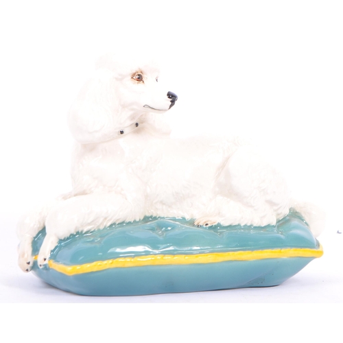 179 - Beswick - A vintage 20th century Beswick porcelain figurine in the form of as cushion seated of a br... 