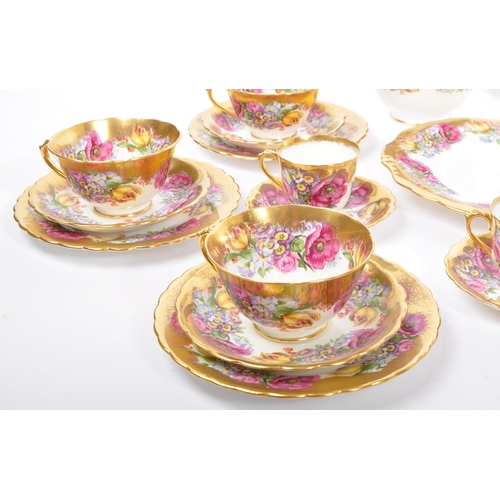 198 - A collection of 20th century English Rose pattern fine bone china tea service in the manner of Royal... 