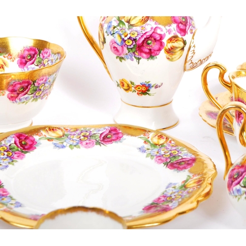 198 - A collection of 20th century English Rose pattern fine bone china tea service in the manner of Royal... 