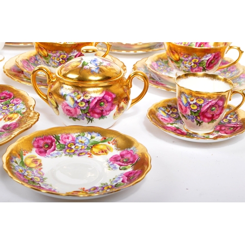 198 - A collection of 20th century English Rose pattern fine bone china tea service in the manner of Royal... 