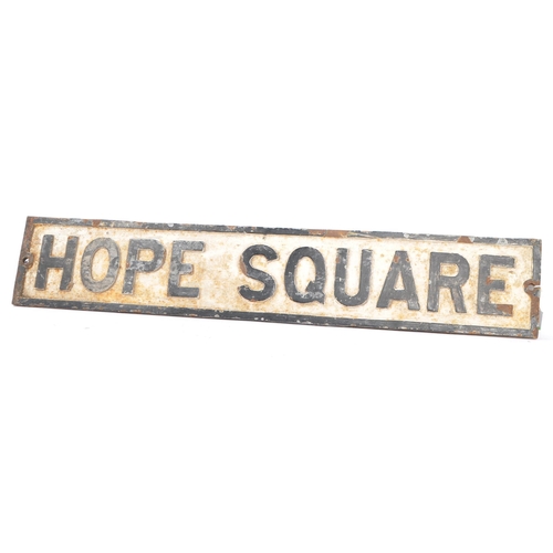 203 - An early 20th Century cast iron street road sign for 'Hope Square'. Black frame with white ground an... 