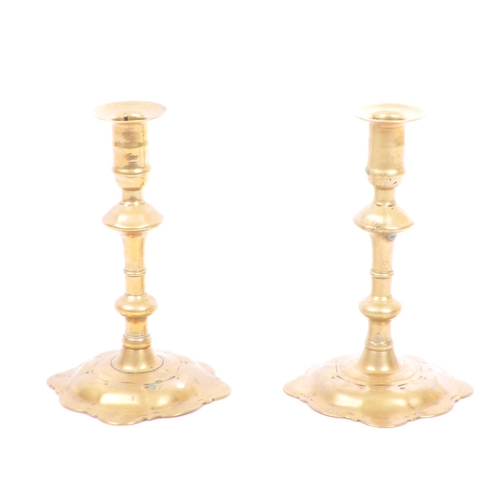 204 - A pair of George the II 18th century brass candle sticks by Joseph Wood. a complete pair with brazin... 