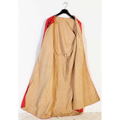 206 - A mid century vintage oriental silk robe of large size. Woven with alternating solid claret coloured... 