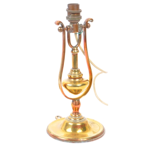 208 - A pair of early 20th century brass ships gimbal electric wall lights. Measures 14cm (height).