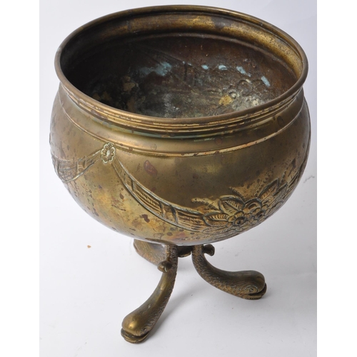 218 - A late 19th century Arts & Crafts brass cauldron pot. Having a flared lipped into a bulbous round bo... 