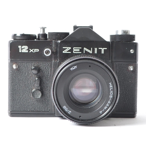 226 - A late 20th century circa 1980s Zenit / Zenith 12 XP 35mm SLR camera. Having black metal body. Seria... 