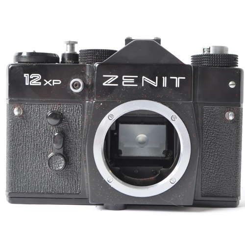 226 - A late 20th century circa 1980s Zenit / Zenith 12 XP 35mm SLR camera. Having black metal body. Seria... 