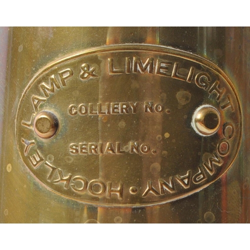 228 - A 20th century brass miners’ lamp by the Lamp & Limelight Company of Hockley. Complete with hanging ... 