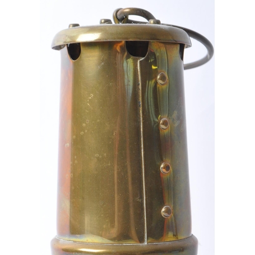 228 - A 20th century brass miners’ lamp by the Lamp & Limelight Company of Hockley. Complete with hanging ... 