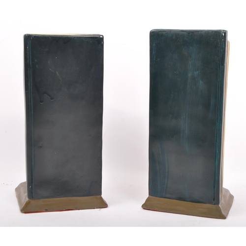 235 - A vintage 1980s pair of ceramic bookends of Stan Laurel and Oliver Hardy. Measures 25.5cm (height).