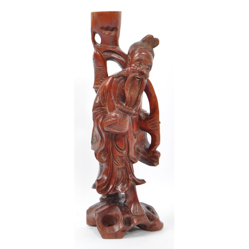 236 - Two vintage 20th century wooden figurines. Consists of a naked Polynesian lady in classic pose, toge... 