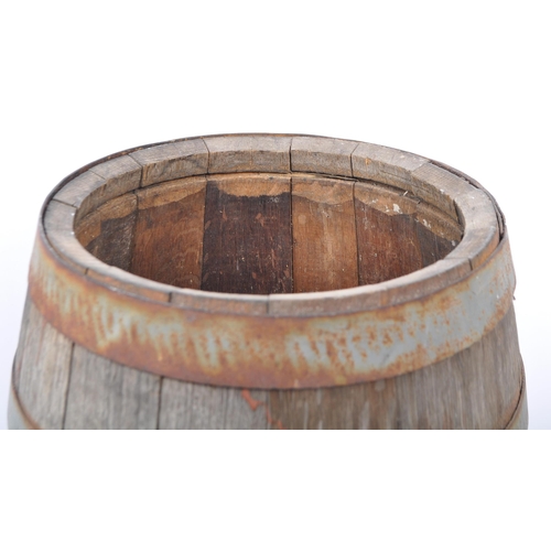 239 - A vintage mid 20th Century coopers wooden barrel with brass tap. Made from oak wood with wrought iro... 