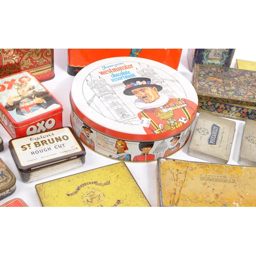 241 - A collection of vintage 20th century and later advertising branded tins in various sizes and colours... 