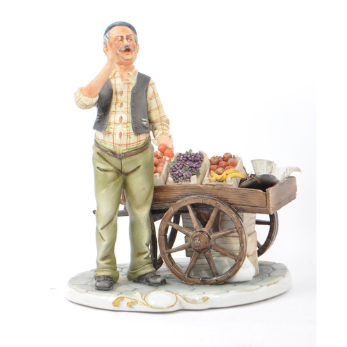 25 - Capodimote - Vintage 20th century Italian porcelain figures. One name fruit vendor with a cart of fr... 