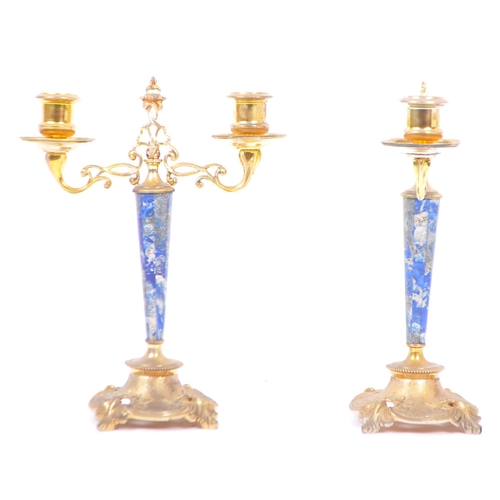 263 - A pair of 20th century brass and gilt metal candlesticks with lapis lazuli decoration to stems. Havi... 