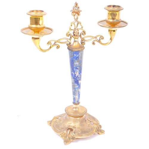 263 - A pair of 20th century brass and gilt metal candlesticks with lapis lazuli decoration to stems. Havi... 