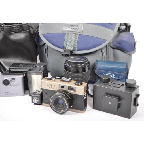 264 - A collection of vintage 20th century and later film cameras, lenses and accessories. Comprising of a... 