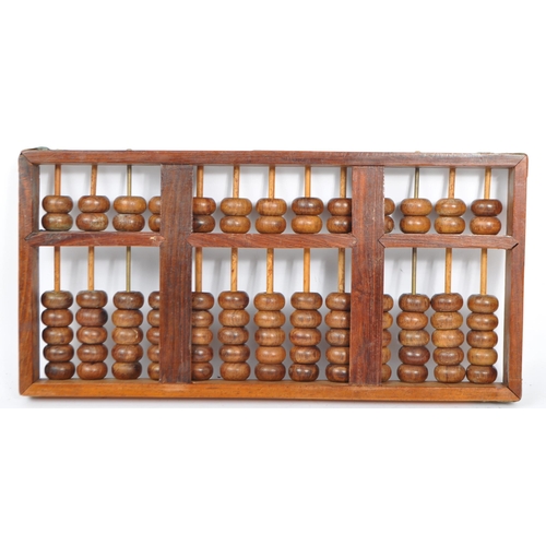 268 - An early 20th century Chinese wooden brass mounted abacus. The abacus being of wooden construction w... 