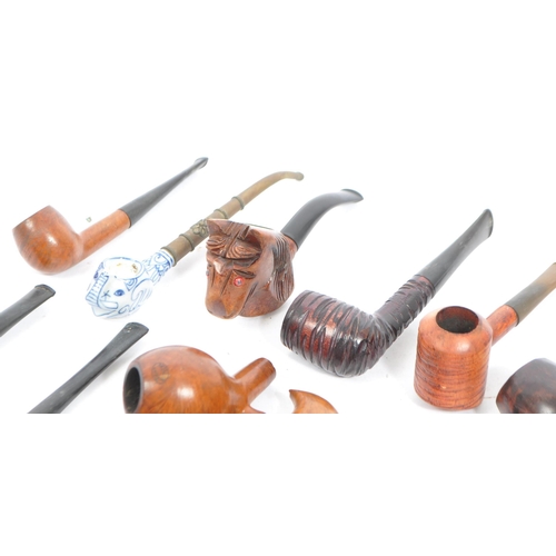 275 - A collection of vintage 20th century smoking pipes. Pipes to include examples by Duncan Dental, Echt... 