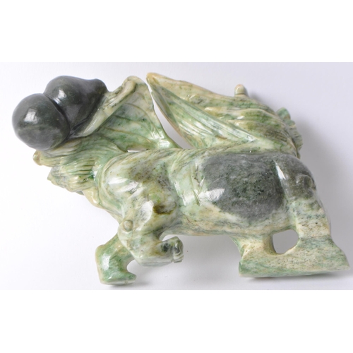 28 - A vintage 20th century Chinese mythological beast green dragon / foo dog / guardian lions. In a stan... 