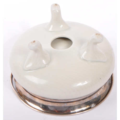 293 - A 20th century ceramic and hallmarked silver censor. The censor having a hallmarked silver collar wi... 