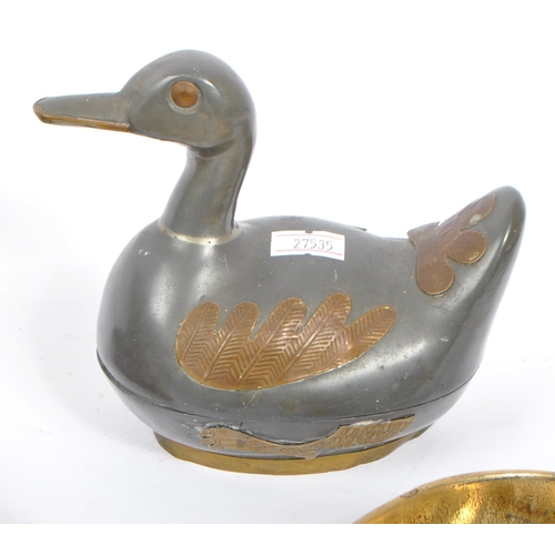 313 - A collection of early to mid 20th century brass items. Comprising of a pewter storage duck, coal sho... 