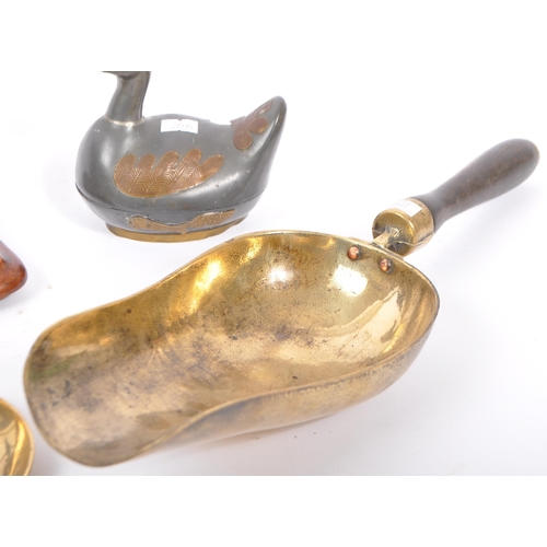 313 - A collection of early to mid 20th century brass items. Comprising of a pewter storage duck, coal sho... 