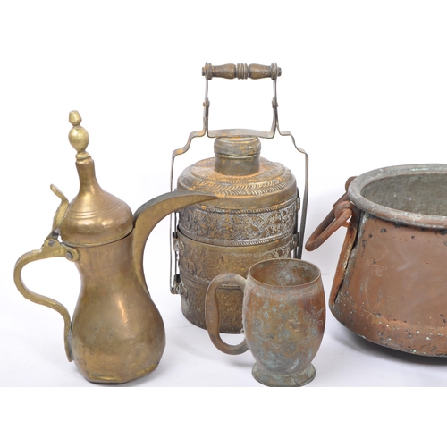 323 - A collection mid century Arabic / Saudi Arabian metal ware / utensils. To include a repousse tiffin ... 