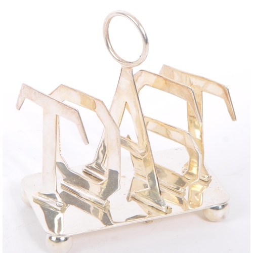 329 - A silver plated toast rack having hoop carry to top with slice dividers to spell out the word 'TOAST... 