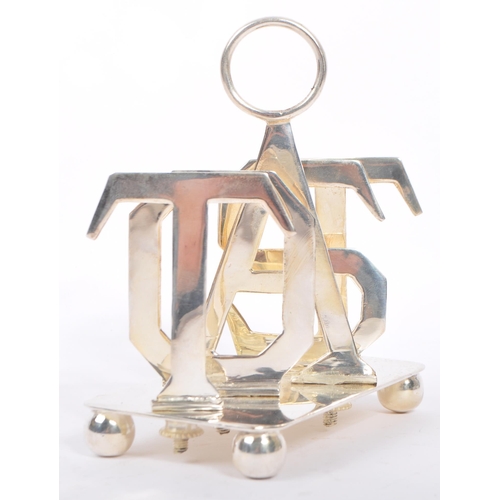 329 - A silver plated toast rack having hoop carry to top with slice dividers to spell out the word 'TOAST... 