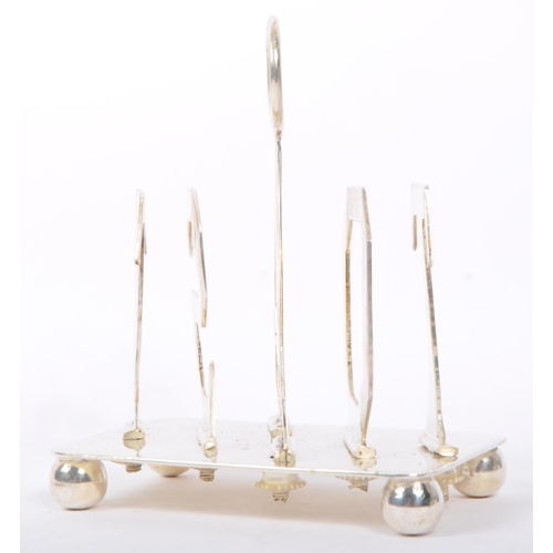 329 - A silver plated toast rack having hoop carry to top with slice dividers to spell out the word 'TOAST... 