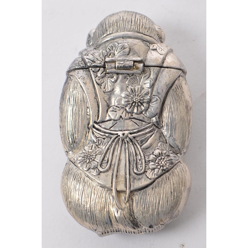 331 - A silver plated vesta case in the form of a monkey. The case having engraved features and being mode... 