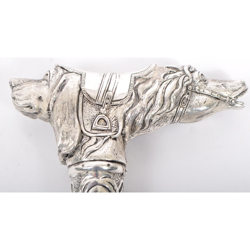 335 - A silver plated walking stick / cane metamorphic handle in the form of horse and dog with floral col... 