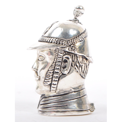 339 - A silver plated vesta case in the form of Victorian policeman wearing a helmet  with moustache. Matc... 