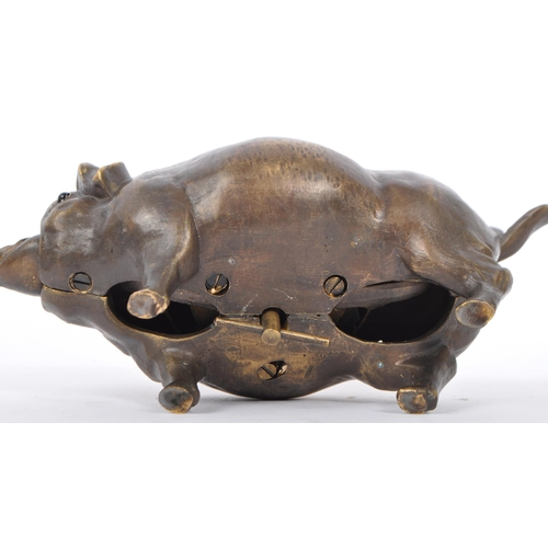 345 - A bronze desk bell in the form of a pig, the underbelly having wind up key with snout and tail influ... 