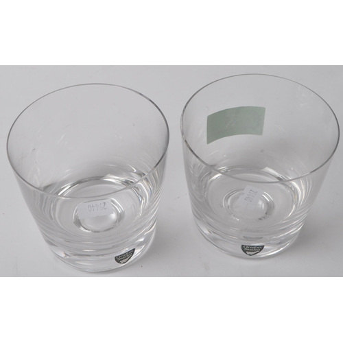 35 - A matching pair of late 20th Century Orrefors clear crystal glass tumblers. With tapering design and... 