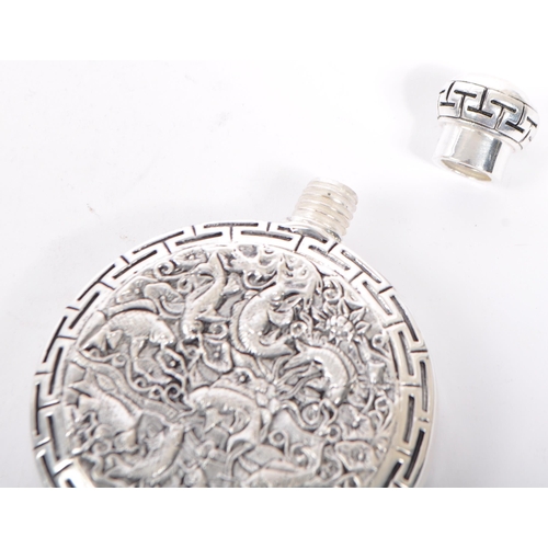 357 - A silver plated Chinese perfume scent bottle having Chinese meander to lid and body with intricate r... 